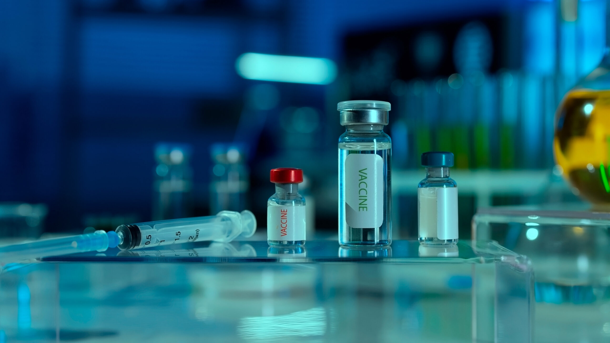 Research peptide vials and syringe in laboratory